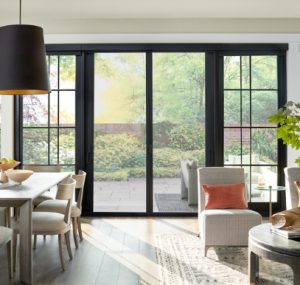 black sliding doors in bright living area