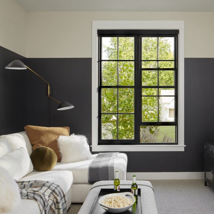 Comfortable living room with black, Pella Reserve window
