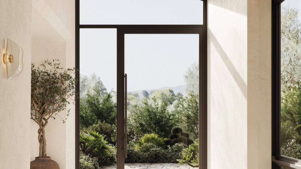 Bright, welcoming entry with sleek aluminum door connecting indoor comfort to lush outdoor greenery.