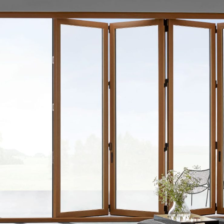 Spacious living area with wooden bifold doors opening to an inviting outdoor space.