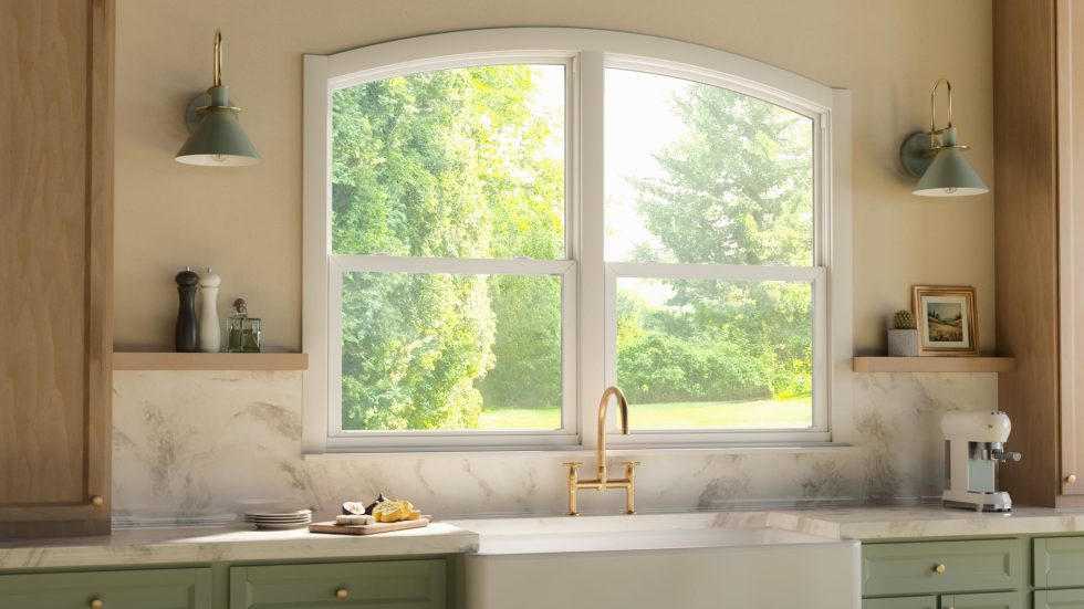 Bright and inviting kitchen with large vinyl windows offering a clear view of lush greenery.